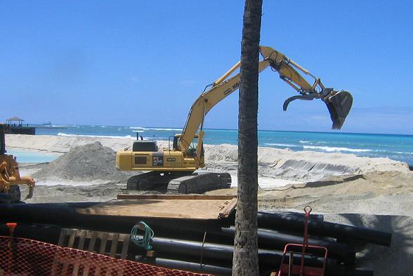 ショベルカーで均して